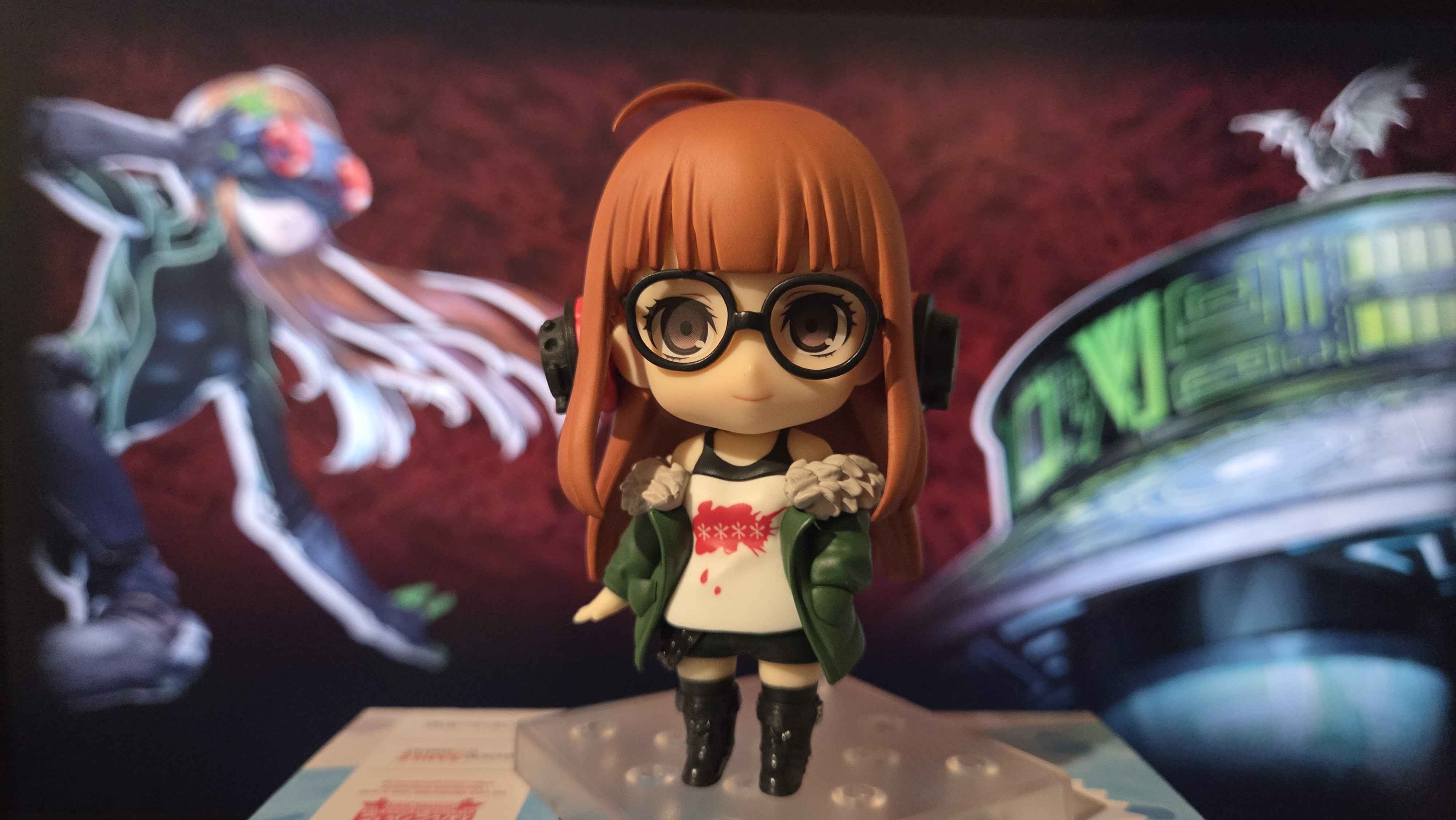 futaba sakura in front of her persona 5 royal steam backdrop