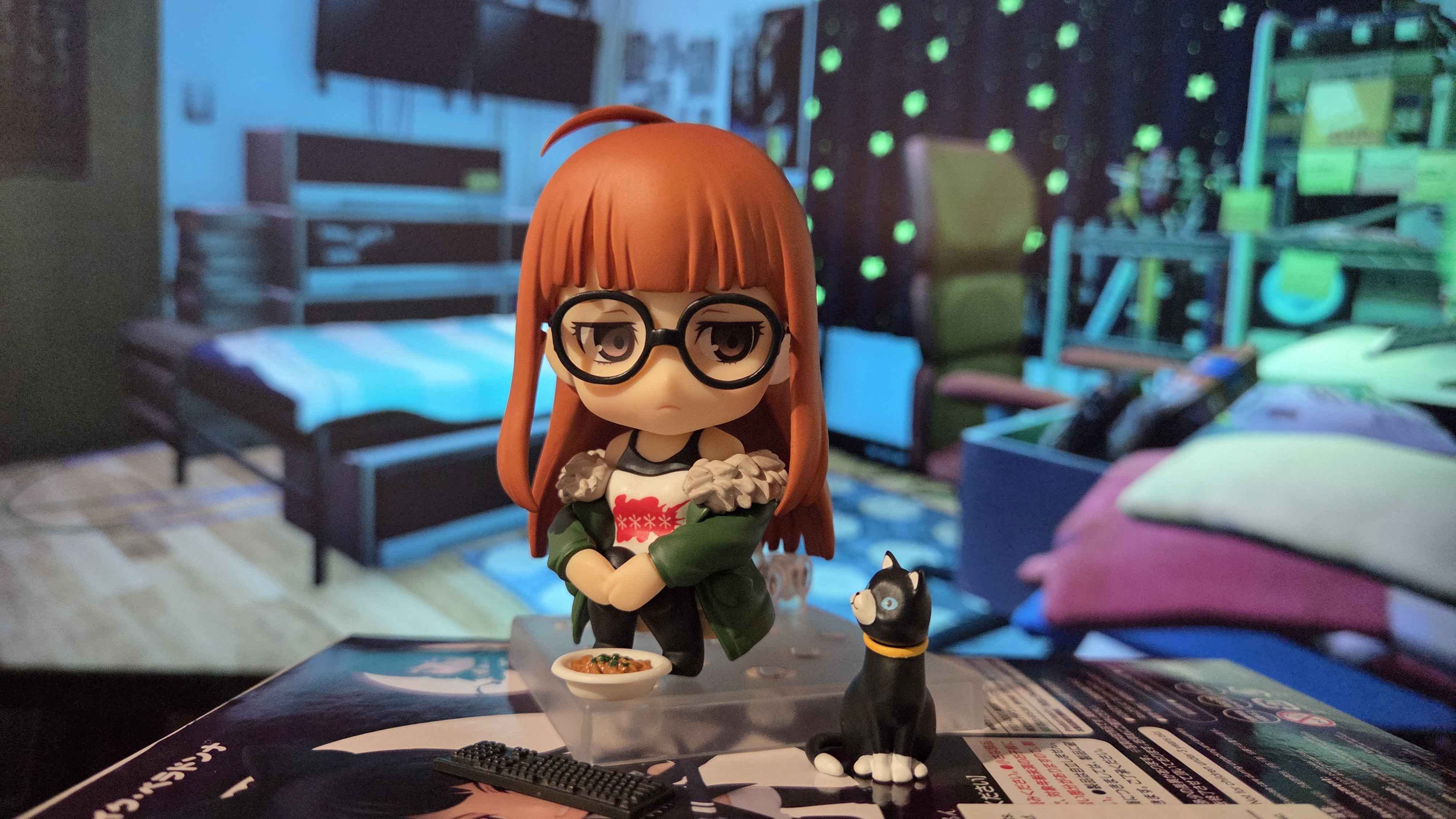 futaba sakura nendoroid with morgana curry and keyboard accessories in front of backdrop of futaba's room